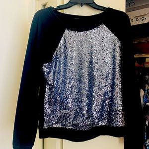 Black sweater with silver sequin.
